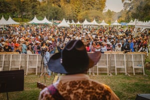 A crowd gathers as Sir Elvis and the Urban Cowboys perform