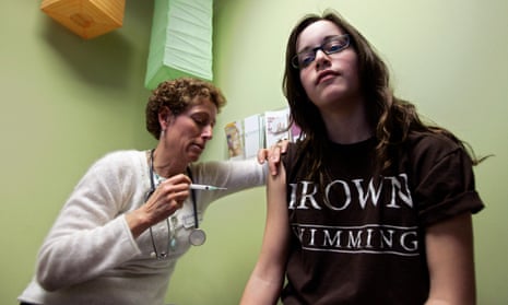 Nancy Brajtbord administers a shot of gardasil, an HPV vaccine, to a 14-year old patient, in Dallas, Texas.