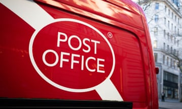 A red Post Office van in central London