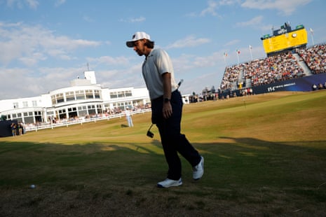 Tommy Fleetwood takes a drop on the 18th hole