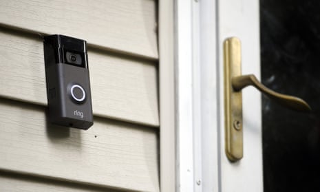 A smart doorbell outside a house.