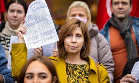Linda Ervine holds a copy of a letter calling for urgent progress on Irish language legislation in Westminster.