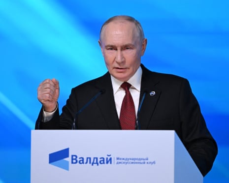 Russia's president Vladimir Putin gestures as he addresses the audience during the Valdai Discussion Club meeting in Moscow.