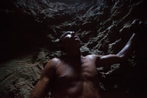 Well-digger José Santos García in a borehole in southern Honduras