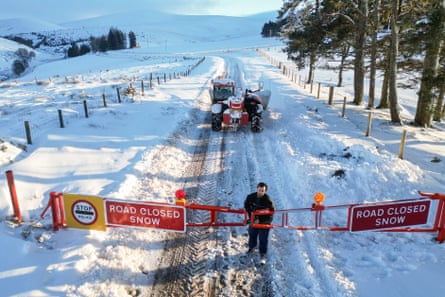 Snow gates closed across a road in Scotland after heavy snowfall.
