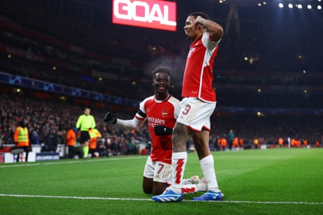 Arsenal's Bukayo Saka (left) celebrates scoring their third goal with fellow goalscorer Gabriel Jesus.