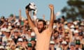 Scottie Scheffler celebrates on the 18th green after winning the Masters.