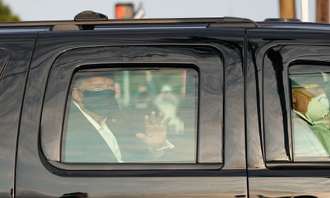 US-POLITICS-TRUMP-HEALTH-VIRUS<br>A car with US President Trump drives past supporters in a motorcade outside of Walter Reed Medical Center in Bethesda, Maryland on October 4, 2020. (Photo by ALEX EDELMAN / AFP) (Photo by ALEX EDELMAN/AFP via Getty Images)