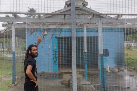 Behrouz Boochani on Manus in 2018, outside the naval base where he and other refugees were detained for his first three years on the island