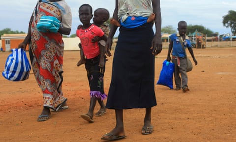 A South Sudan refugee family arrives at the UNHCR refugees reception point in Elegu,  northern Uganda.