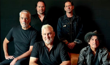 The five members of Afghan Whigs wearing black, arranged against a black background