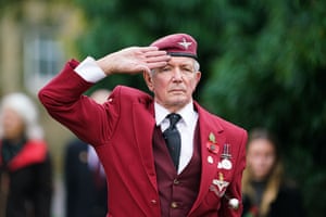 A veteran of the parachute regiment salutes in Falmouth, Cornwall