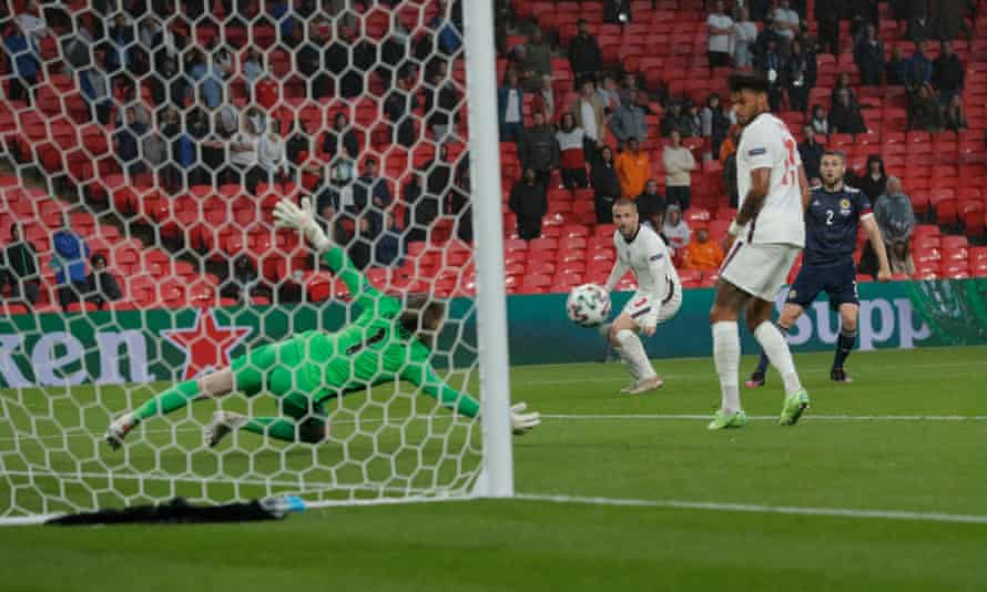 Jordan Pickford saves well from Stephen O’Donnell in the first half at Wembley