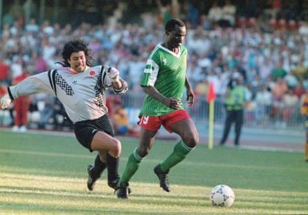 Roger Milla walks the ball into the empty net to score the winning goal after dispossessing Colombia’s goalkeeper René Higuita.