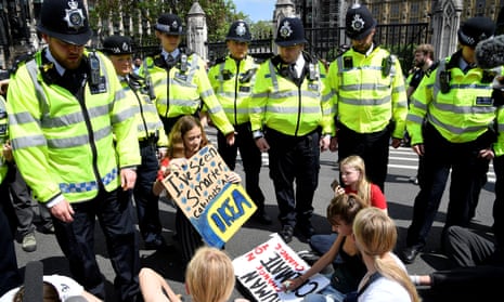 Police in London, this May, with climate crisis demonstrators.