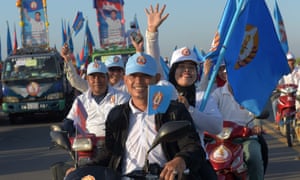 The Cambodian People’s Party (CPP) has held power for 32 years. Here supporters ride their motorbikes on the last day of the commune election campaign.