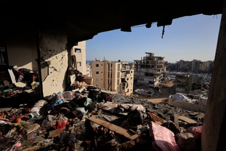 People's belongings lie scattered at the site of an Israeli strike on an apartment building in Gaza City.