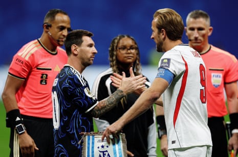 Harry Kane and Lionel Messi shake hands before the match.