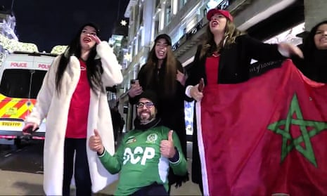 Morocco fans celebrate in London after their world cup win against Spain.