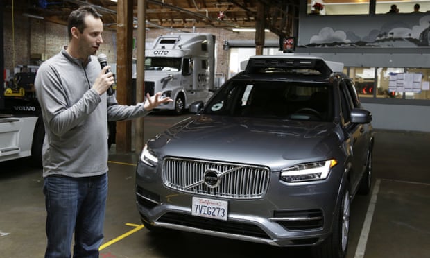 Anthony Levandowski, head of Uber’s self-driving program, speaks about their driverless cars in San Francisco. An Otto self-driving truck can be seen in the background.