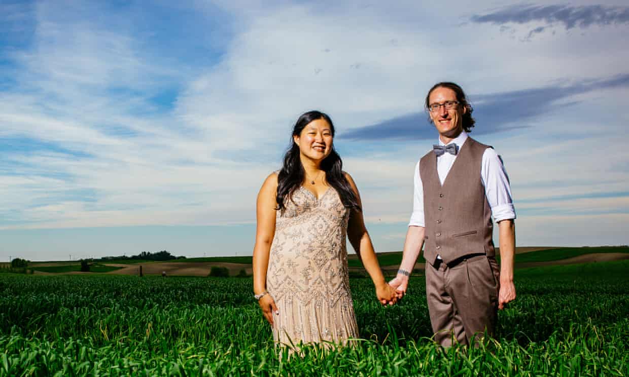 Keri and her husband Alex in a field - Photograph: provided by Keri Nelson for The Guardian