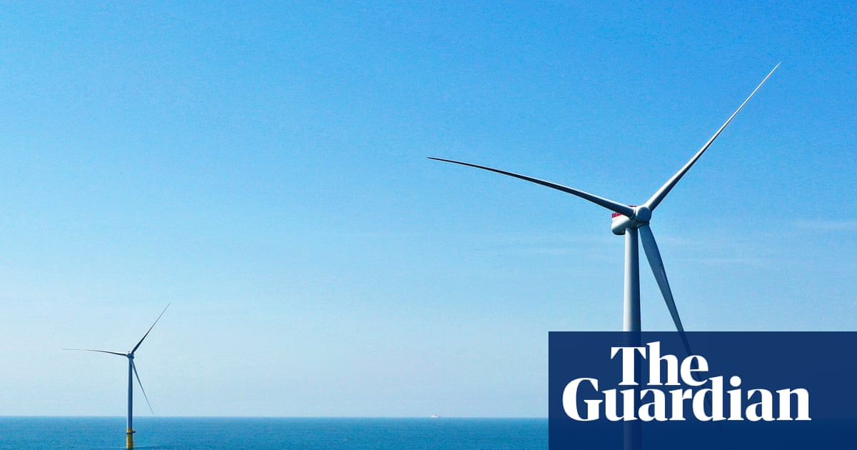 The Trump energy strategy in one image: a wind turbine being quietly dismantled while an oil rig gets a taxpayer-funded champagne bath in the background.