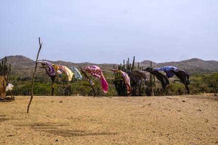 Washing hung out on a clothesline in a desert area.