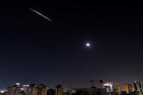 Rocket trails are seen above the Israeli coastal city of Netanya.