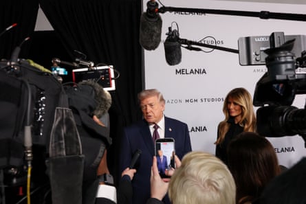 Donald and Melania Trump speak to the media as they arrive for the premiere of Melania at the Trump-Kennedy center in Washington DC.