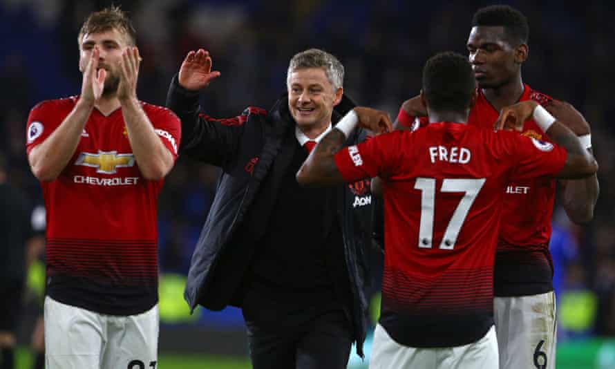 Ole Gunnar Solskjær celebrates with his Manchester United after the 5-1 win at Cardiff in his first game as interim manager, in December 2018