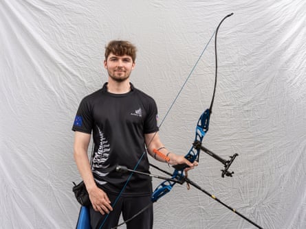 A young archer poses for a portrait