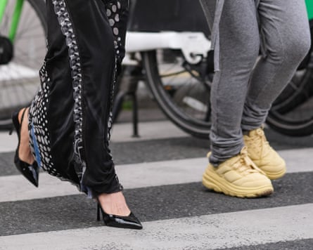 Yellow Marni x Hoka sneaker shoes, outside Ottolinger during Paris fashion week in March 2025.