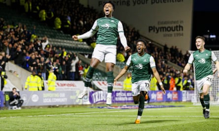 Niall Ennis celebrates after his overhead kick gives Plymouth Argyle the lead.
