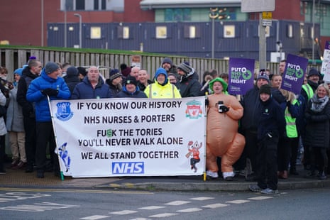 Health workers outside Aintree university hospital in Liverpool. Ambulance staff are on strike across England today, and other NHS staff are also on strike in Liverpool.