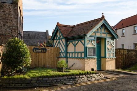 Mock Tudor small building in pink and green