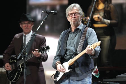 Low (left) playing with Eric Clapton at the Crossroads festival at Madison Square Garden, New York, in April 2013.