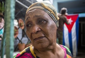 Rafaela Vargas mourns the death of former President Fidel Castro at the entrance of her home in the Vedado neighborhood of Havana