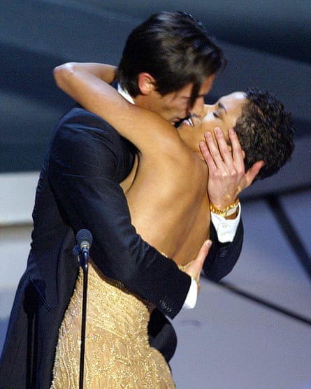 Adrien Brody kisses presenter Actress Halle Berry as he accepts his Oscar for Performance by an actor in a leading role for his role in The Pianist during the 75th Academy Awards in 2003.