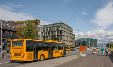 Harpa museum in background, yellow Besta Leidin public transport bus