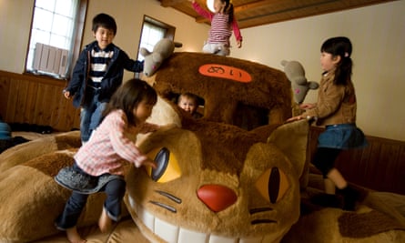 Children play on Cat Bus – a recreation of a character from the animated film My Neighbour Totoro inside Ghibli Museum, Tokyo