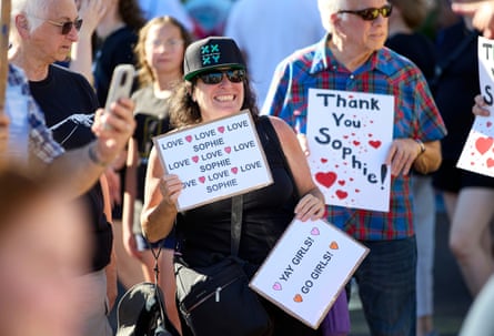People rally to support Sophie Cunningham after her comments on transgender athletes in women’s sports before a game between the Fever and Fire in Portland on Friday night.