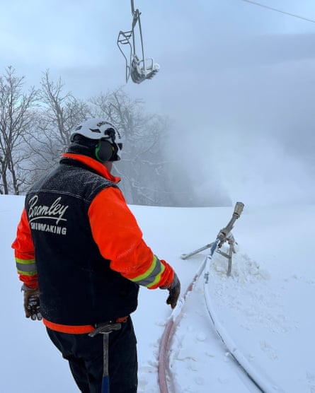 Matt Folts checks a snowmaking gun that is blowing fresh flake on the Blue Ribbon trail at Bromley Mountain Ski Resort.