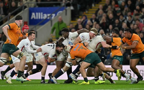 Luke Cowan-Dickie holds on to the ball as England’s maul carries him over the line.
