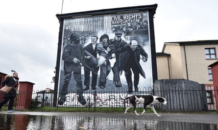 A mural in Derry depicting the famous image of Jackie Duddy being carried away after being shot.