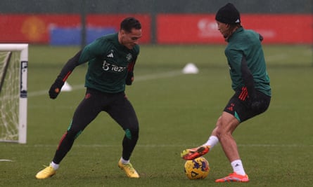 Antony and Hannibal Mejbri of Manchester United contest the ball in training.