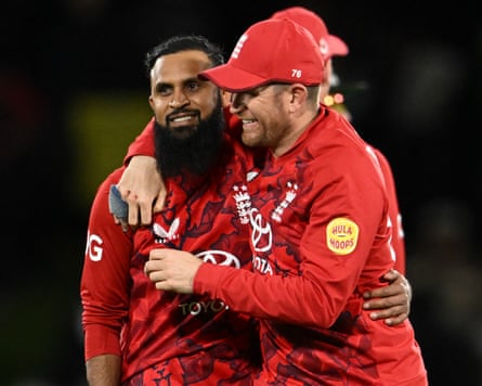 Adil Rashid (left) receives congratulations from Liam Dawson after having Jimmy Neesham caught.