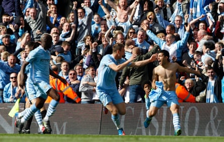 Manchester City’s Sergio Aguero (right) celebrates his winning goal with teammates Mario Balotelli (left) and Edin Dzeko in front of the ecstatic City fans.