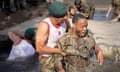 Raheem Sterling successfully completes the 'sheep dip' on the Royal Marines’ endurance course