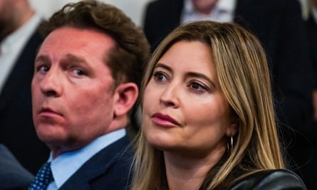 Closeup of Holly Valance and Nick Candy seated among an audience