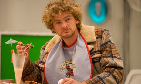 A shot from the film Bunny and the Bull of Simon Farnaby as Bunny. He is wearing a bib and drinking from a curly straw